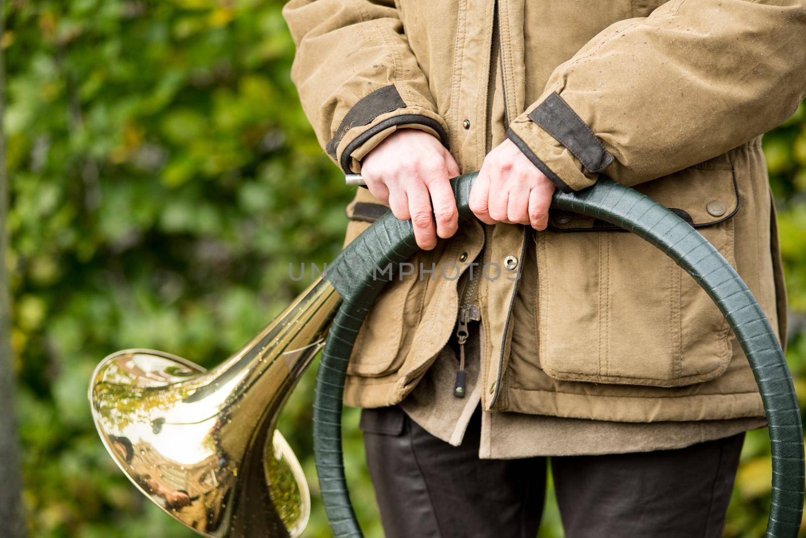 French horn band held in hands by a hunter on Saint Hubertus Day, 05/11/2017, De Moer, The Netherlands