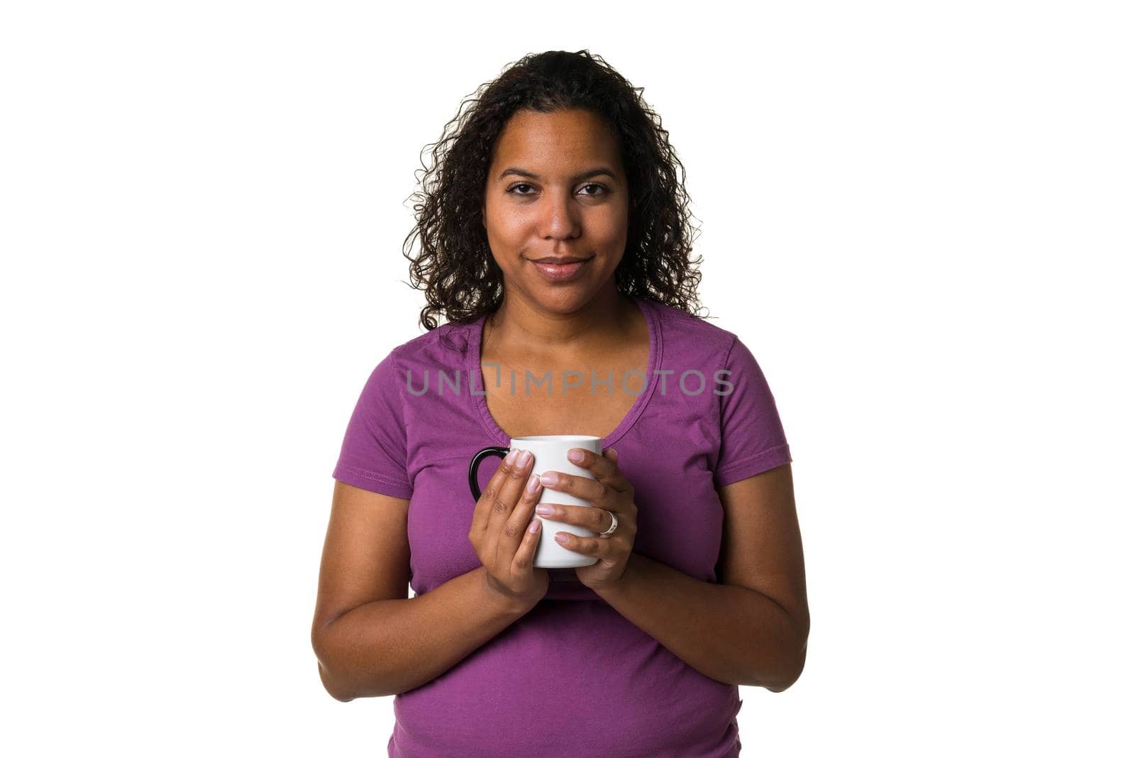 Young mixed race woman in purple shirt drinking a hot liquid from a black and white cup isolated with a white background by LeoniekvanderVliet