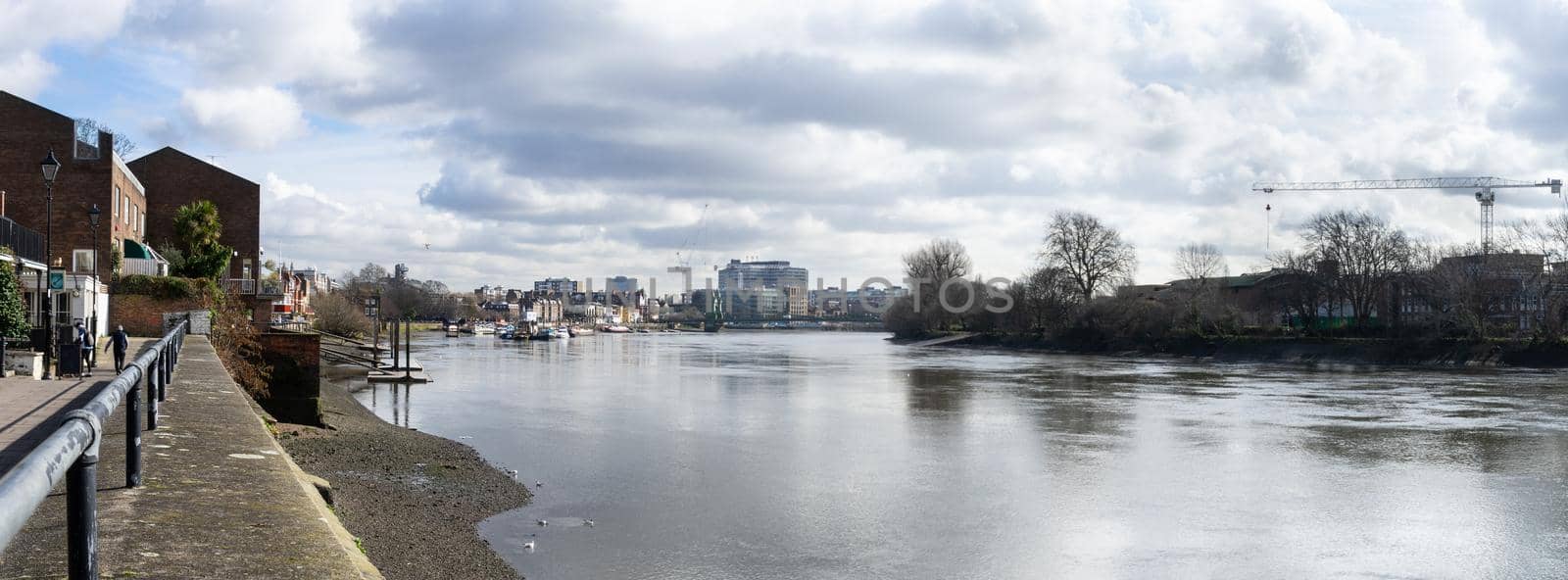 Panoramic view of river Thames toward the City, from Thames path, near Hammersmith. London, England, March 2017. At low tide by LeoniekvanderVliet