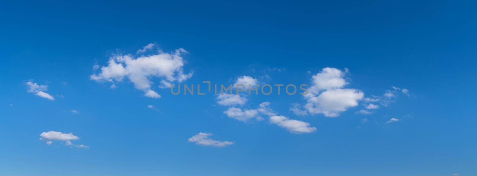 Blue sky with white clouds in the summer by LeoniekvanderVliet