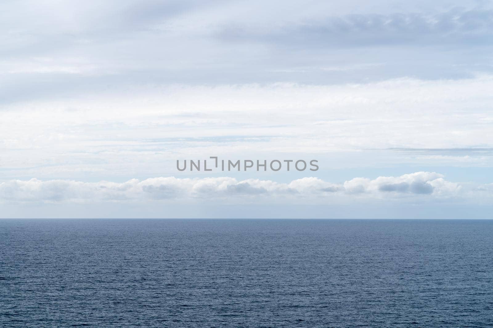 A Blue and white sky with clouds over sea or ocean. Nature composition. Background, landscape