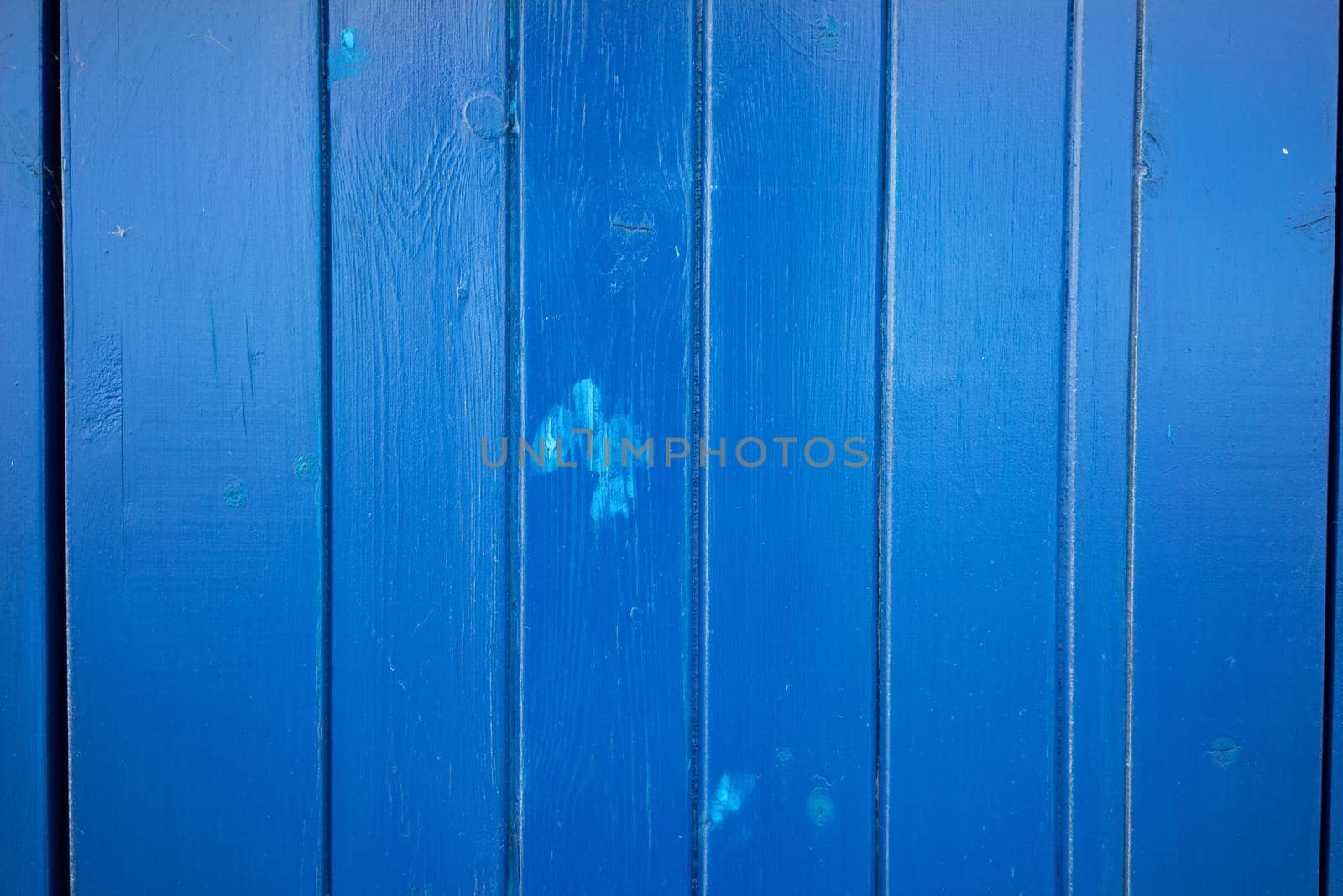 A Bright dark blue color wood plank texture. Vintage beach wooden background.