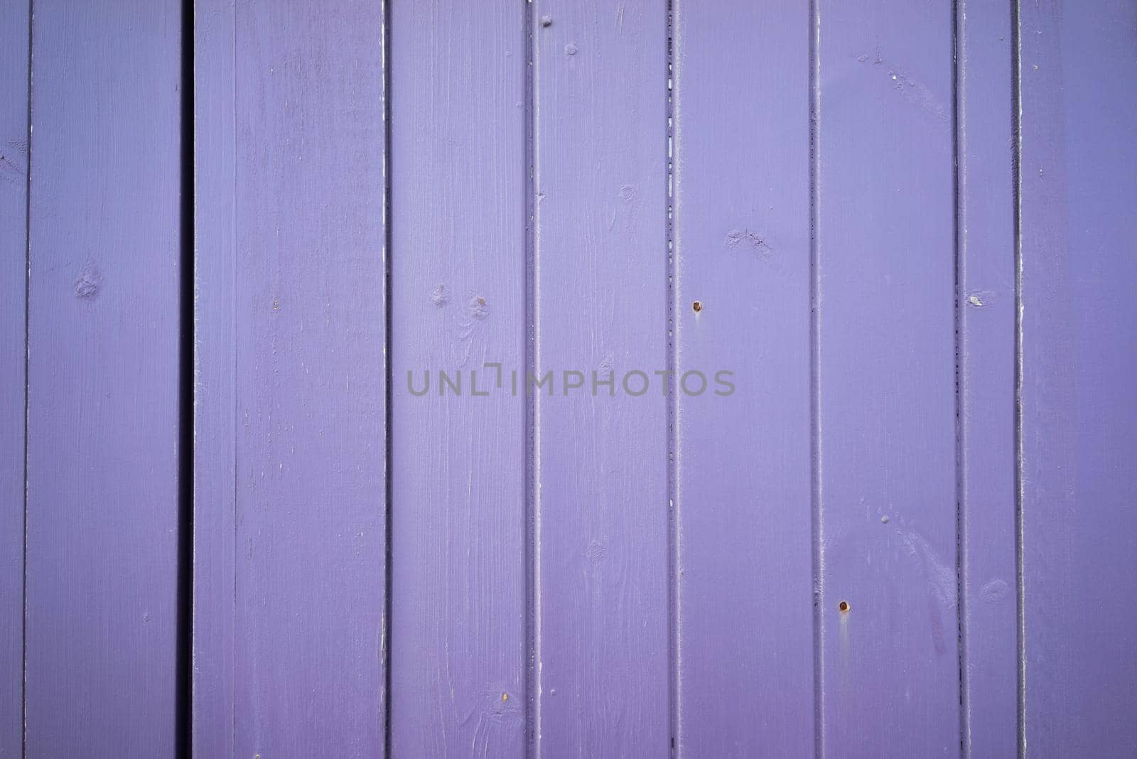 A Bright light purple color wood plank texture. Vintage beach wooden background.