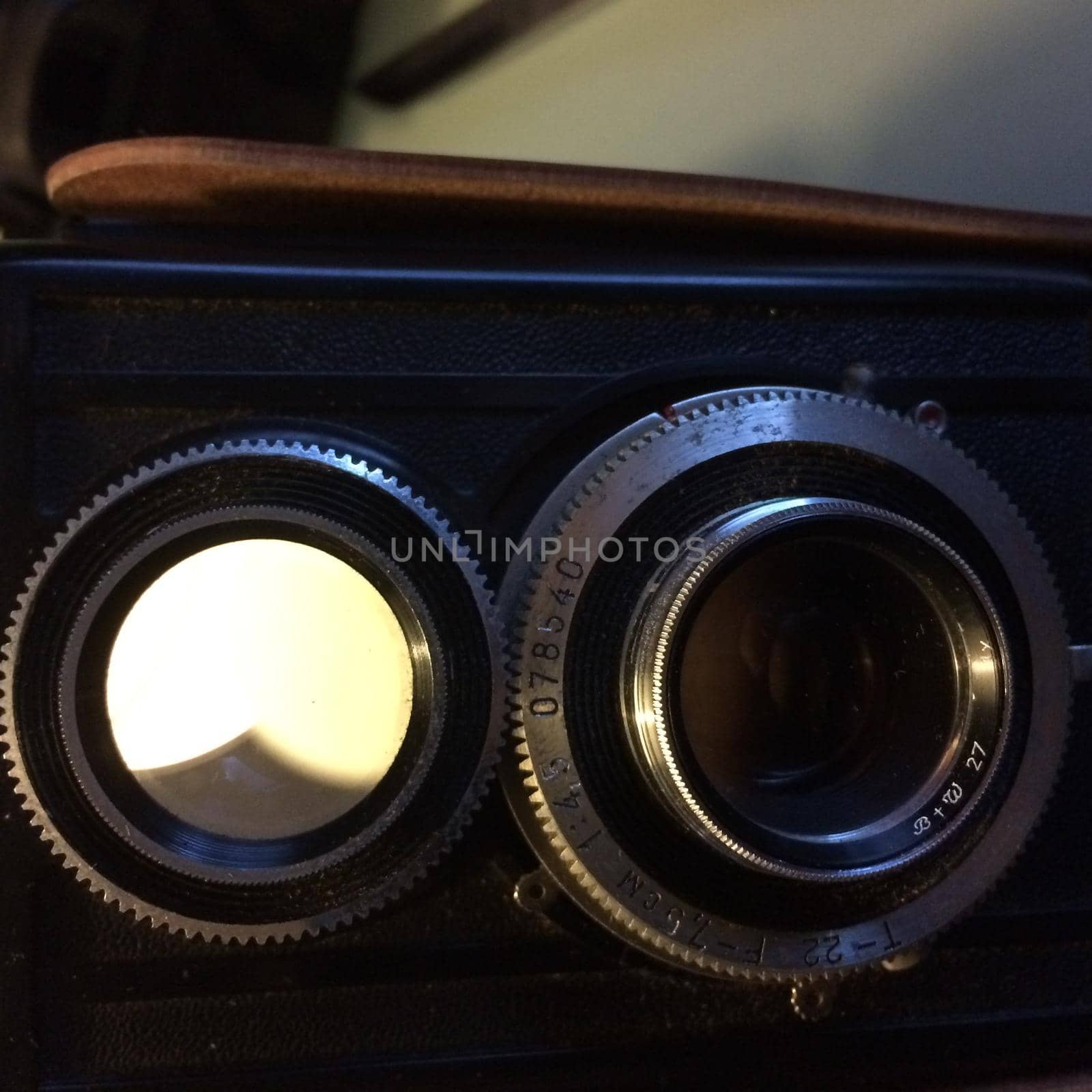 aA Closeup of an old vintage film camera with two lenses