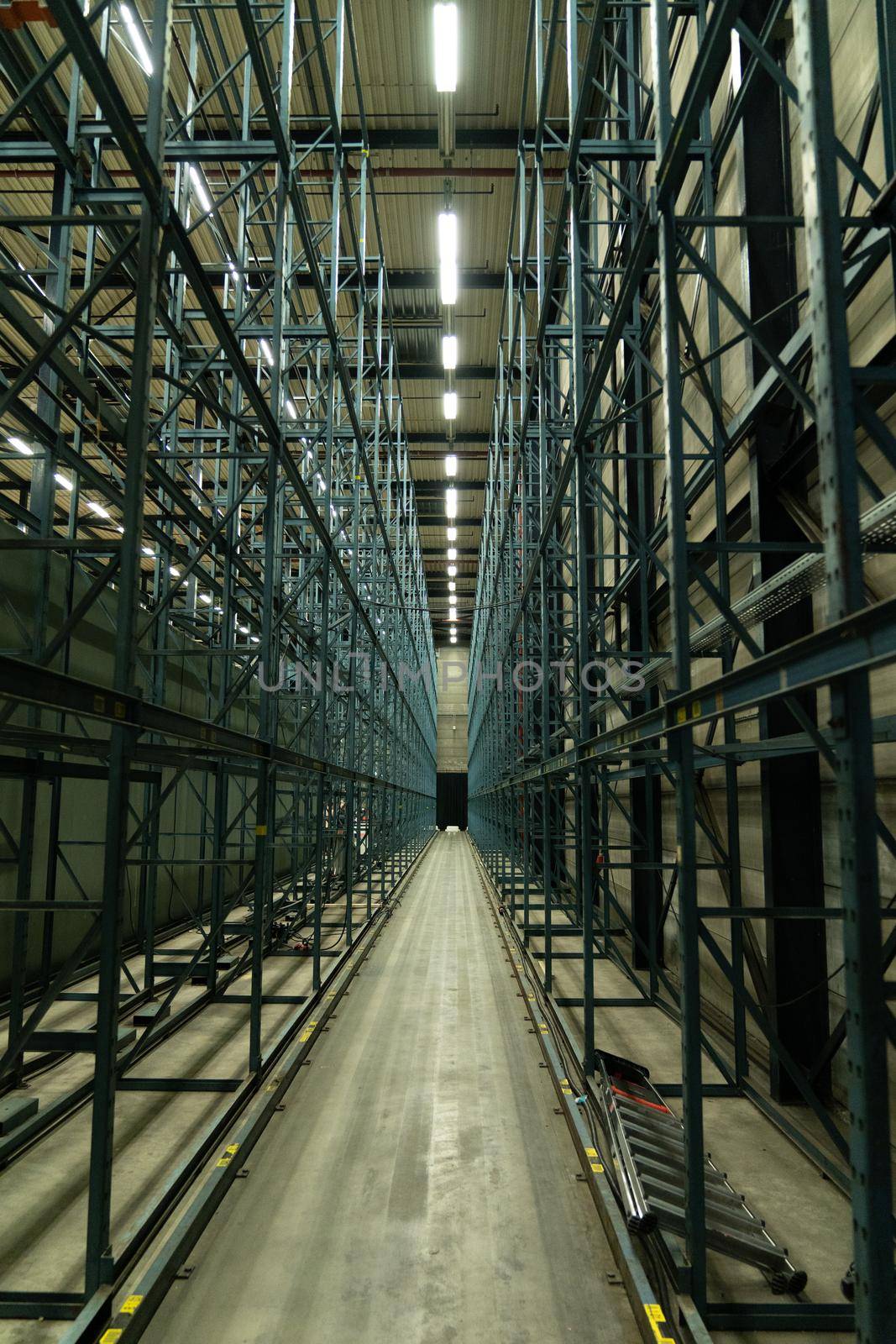 A perspective view of an old warehouse rack in green