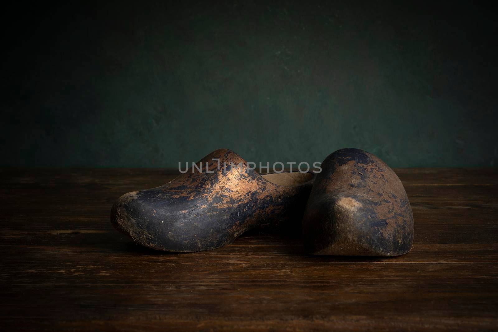 A pair of clogs or wooden shoes typical for the Dutch culture in a stillife setting, Holland or The Netherlands by LeoniekvanderVliet