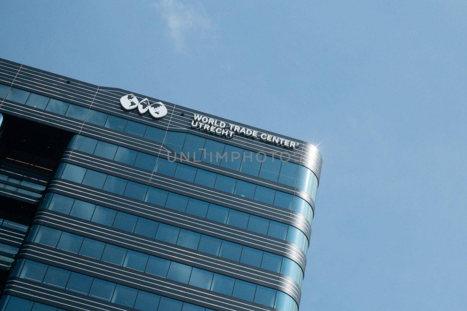 JAARBEURSPLEIN, UTRECHT / THE NETHERLANDS - april 4, 2019: Facade of the Utrecht World Trade Center office building against blue sky.