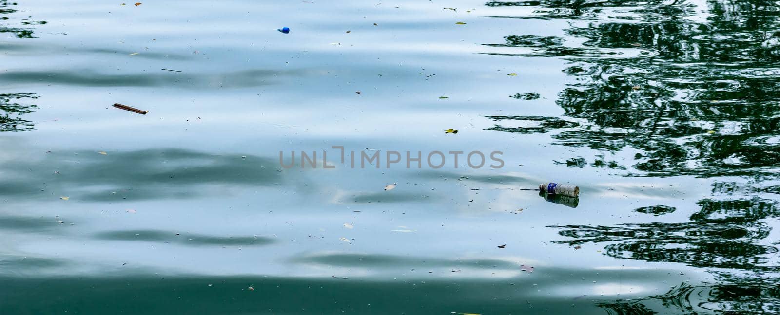 Plastic trash floating on ocean polluting the waters