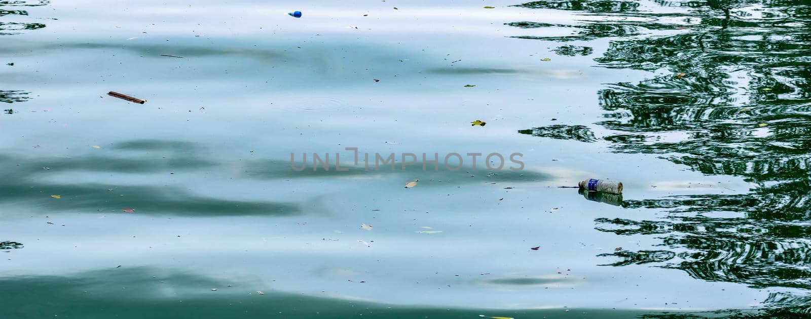 Plastic garbage in a river polluting the waters