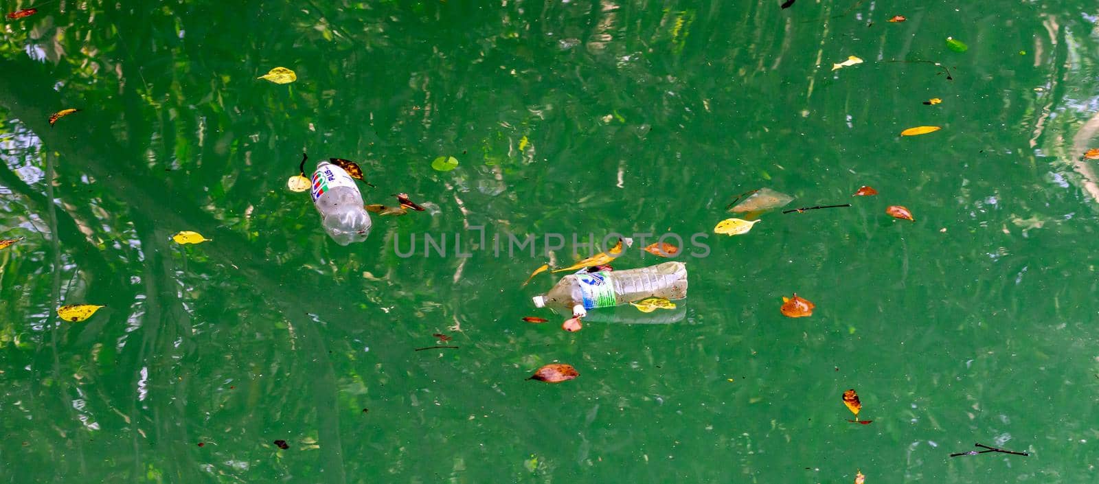 Bottled waters while floating on ocean polluting the waters