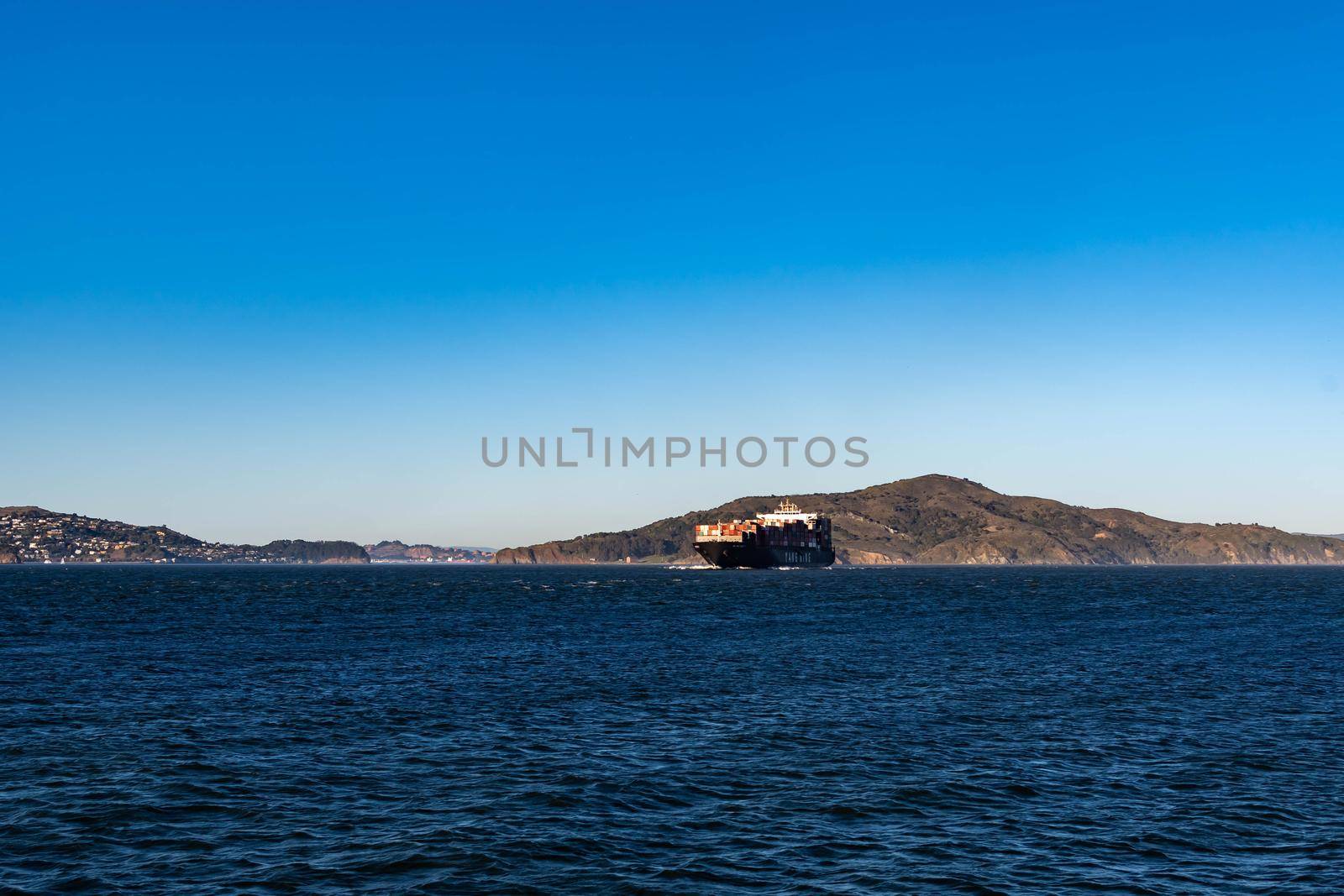Container ship while cruising the pacific ocean near San Francisco Bay, San Francisco CA USA, March 30, 2020 by billroque