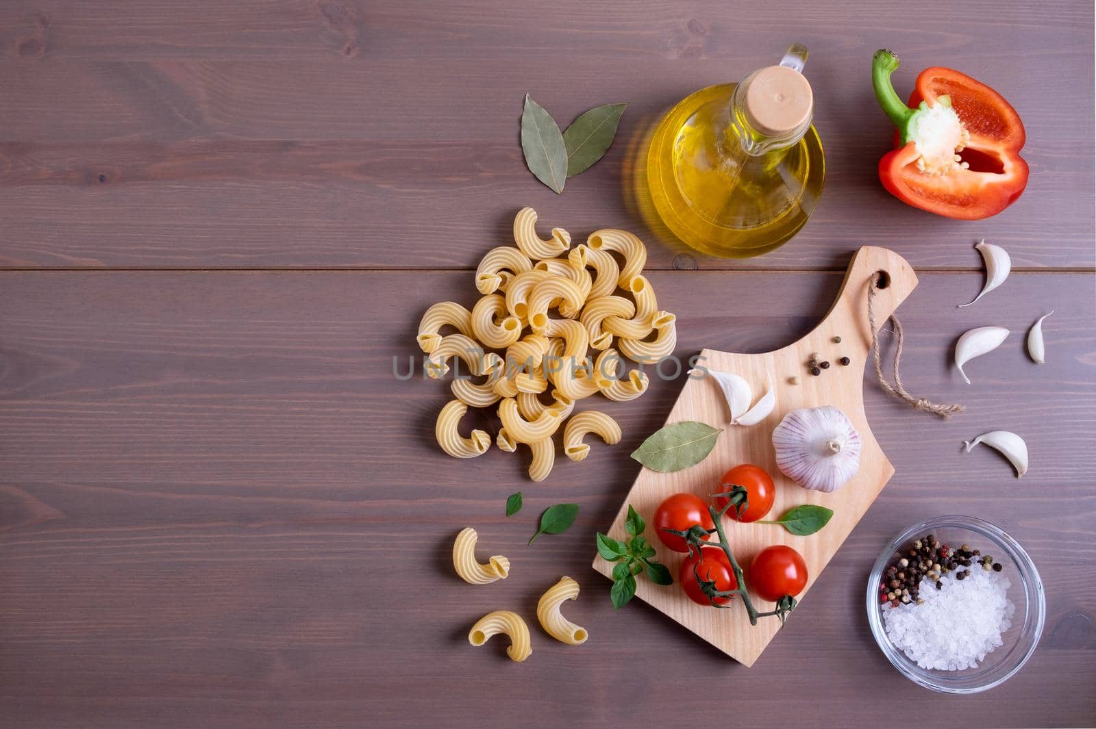 Close-up top view of ingredients for making Italian pasta. Healthy and wholesome food concept. Selective focus. Copy space.