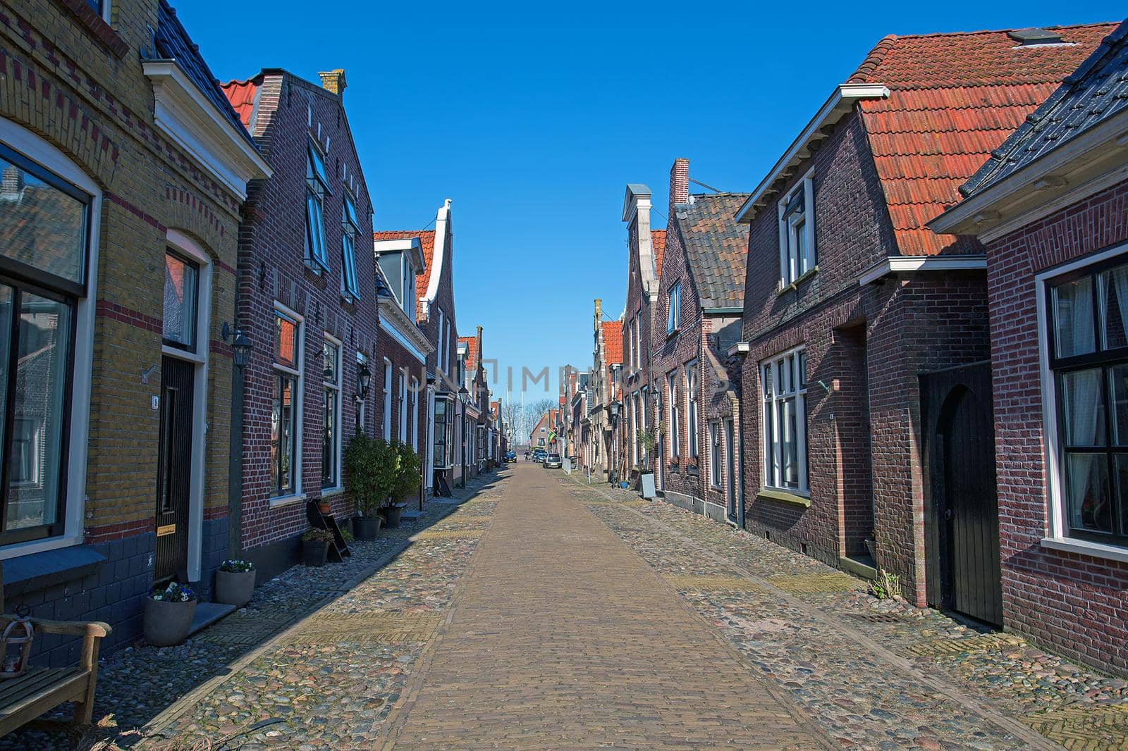 Medieval houses in the streets of Hindeloopen in the Netherlands by devy