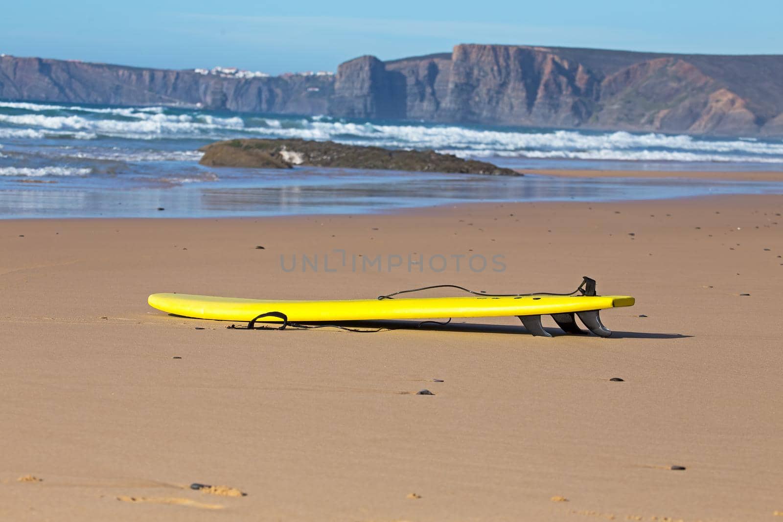 Surfboard lying on the beach in Portugal by devy
