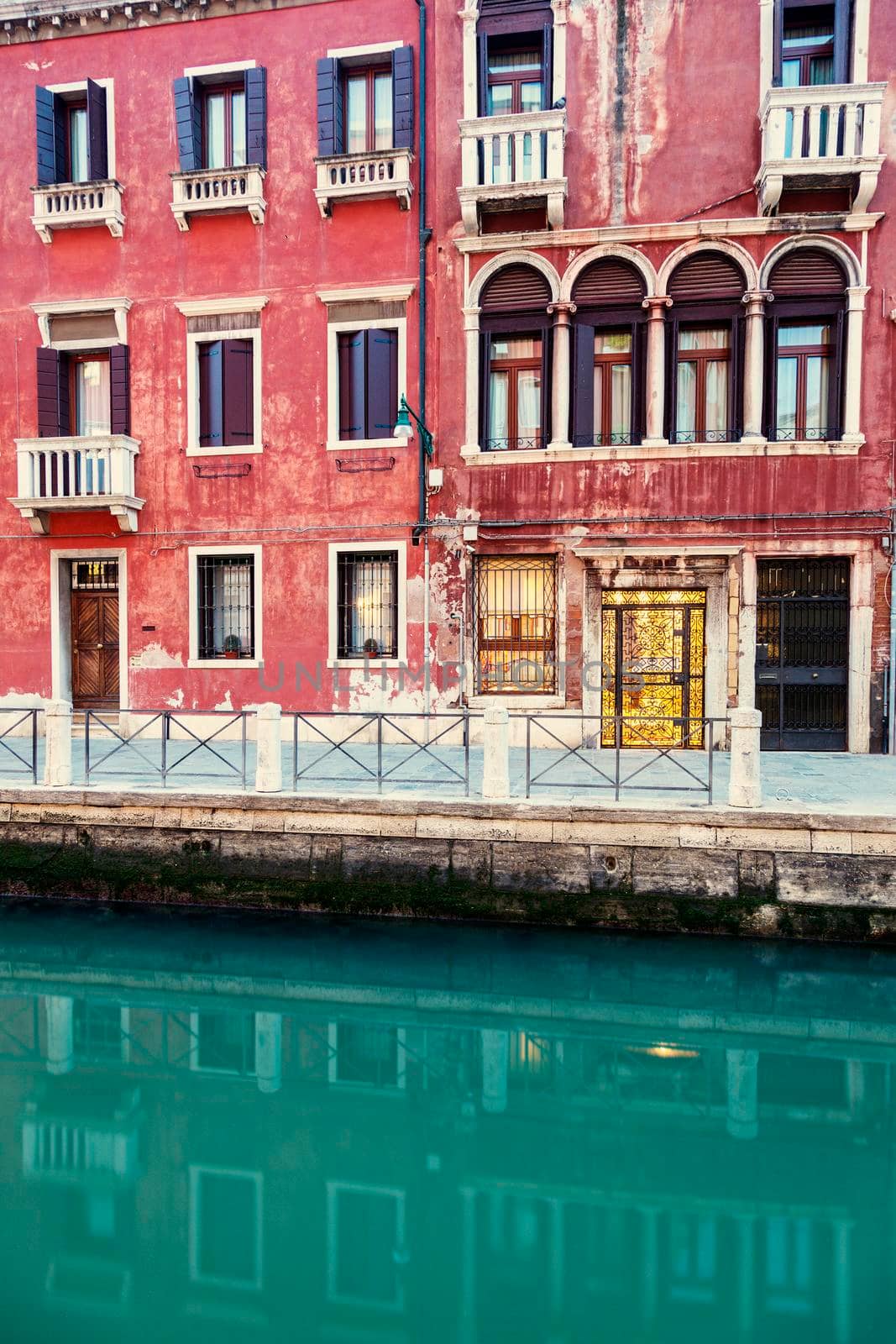 Architecture of Venice - houses reflected in the canal. Venice, Veneto, Italy