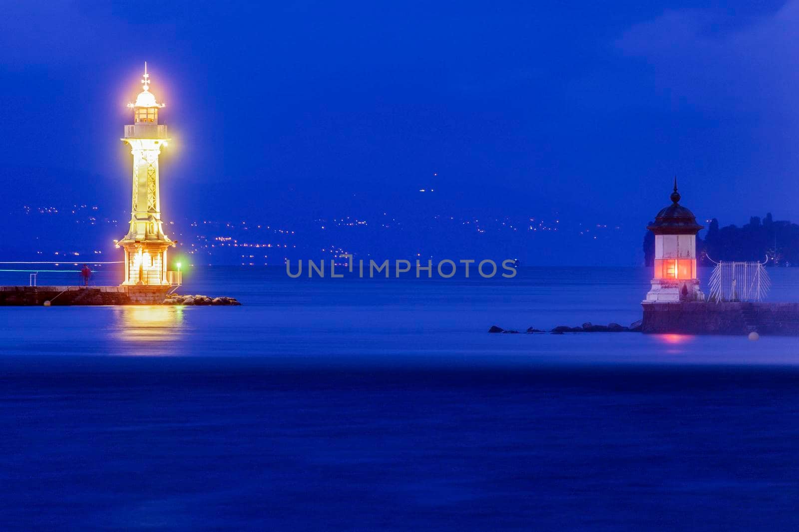 Geneva Lighthouses at night. Geneva, Switzerland.
