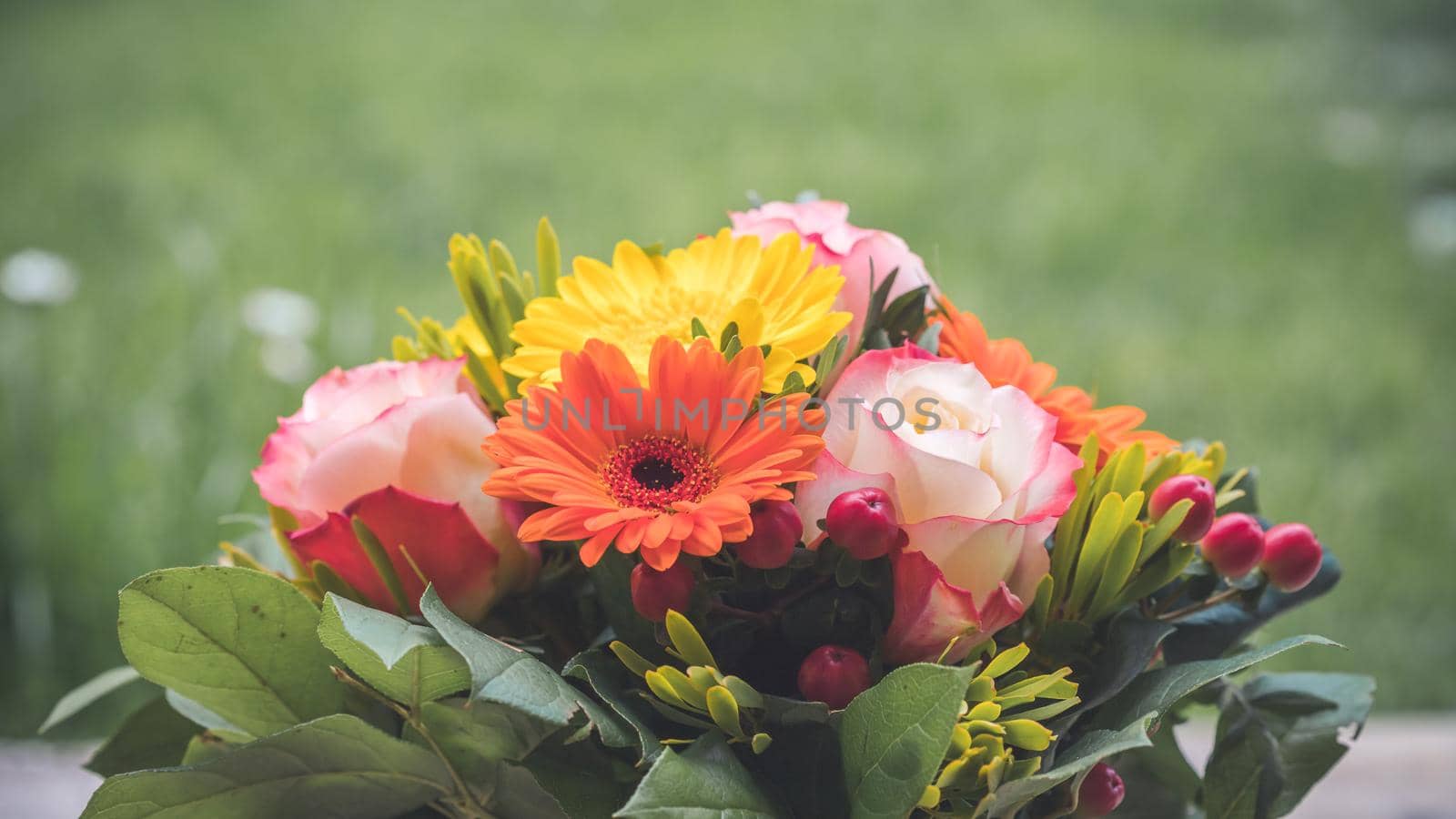 Close up of spring flower bouquet with gerbera and roses