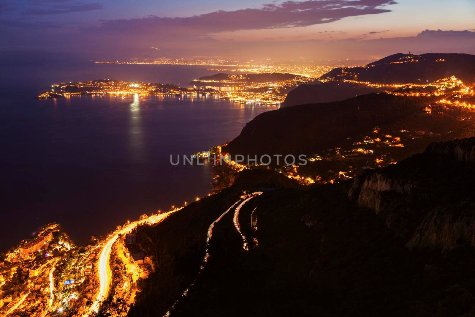 Distant view of Saint Jean Cap Ferrat and Nice at sunset seen from Monaco. Saint Jean Cap Ferrat, French Riviera, France.