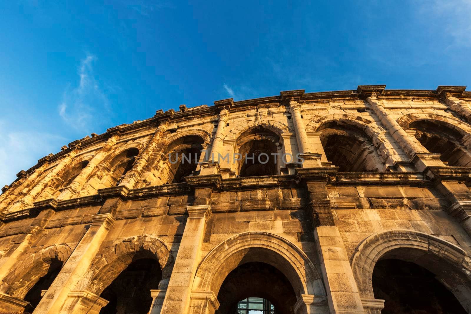Arena of Nimes at sunset. Nimes, Occitanie, France.