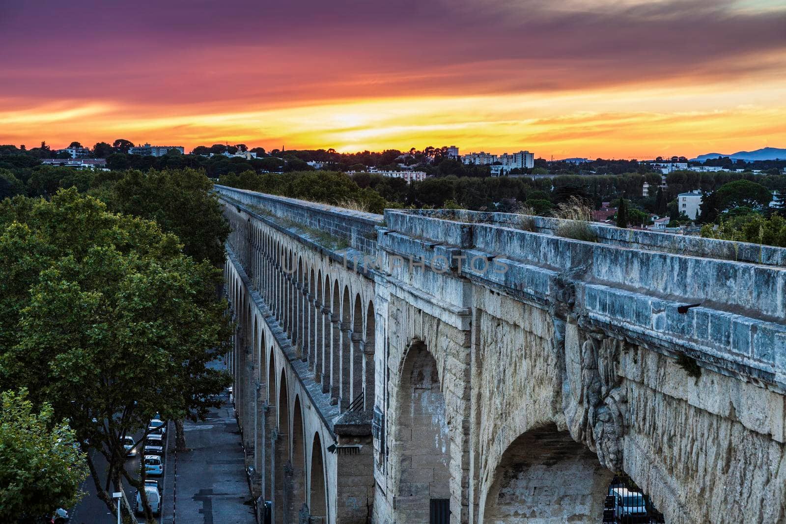 Saint Clement Aqueduct in Montpellier at sunset. Montpellier, Occitanie, France.