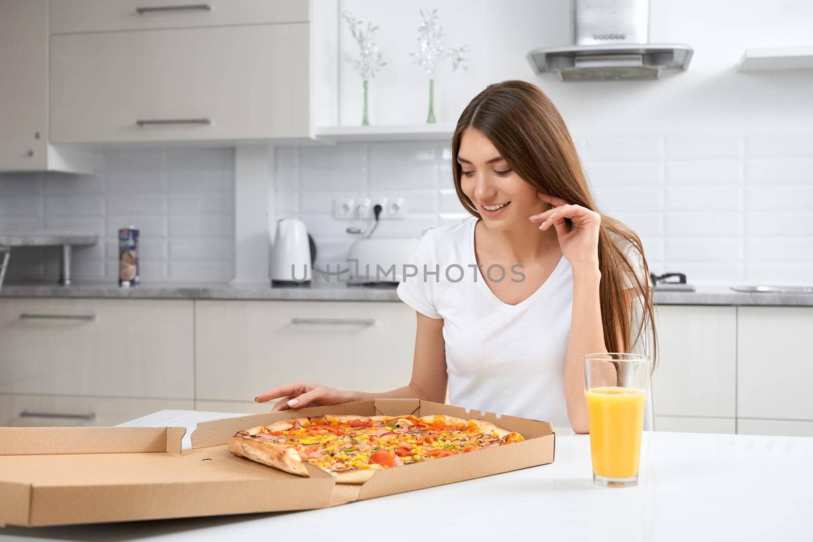 Beautiful woman eating delicious pizza. by SerhiiBobyk