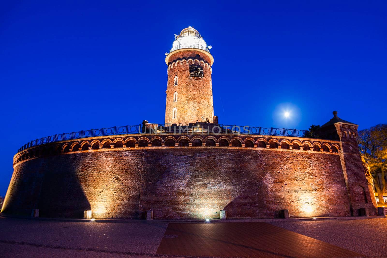 Kolobrzeg lighthouse at evening by benkrut