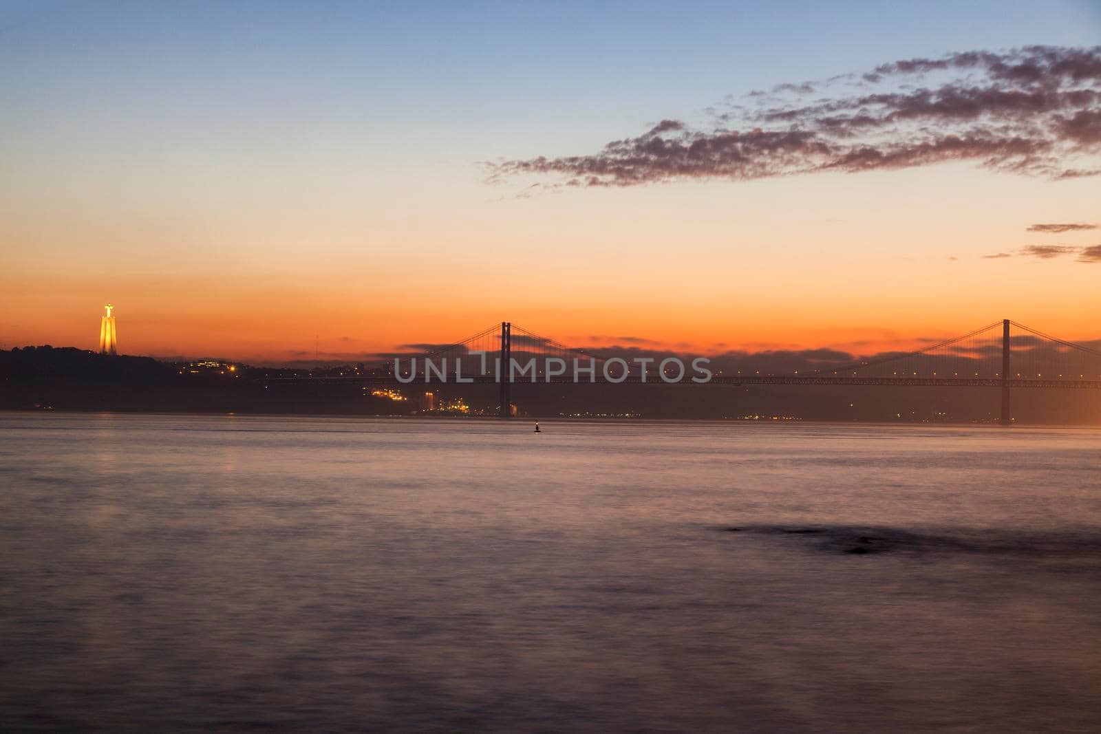 25th of April Bridge and Cristo Rei Statue in Lisbon by benkrut