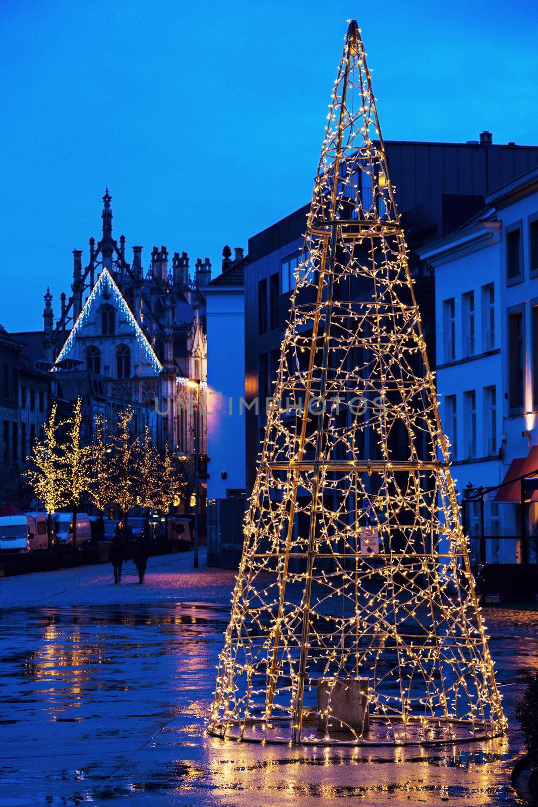 Christmas tree on Veemarkt in Mechelen. City Hall in the back. Mechelen, Flemish Region, Belgium