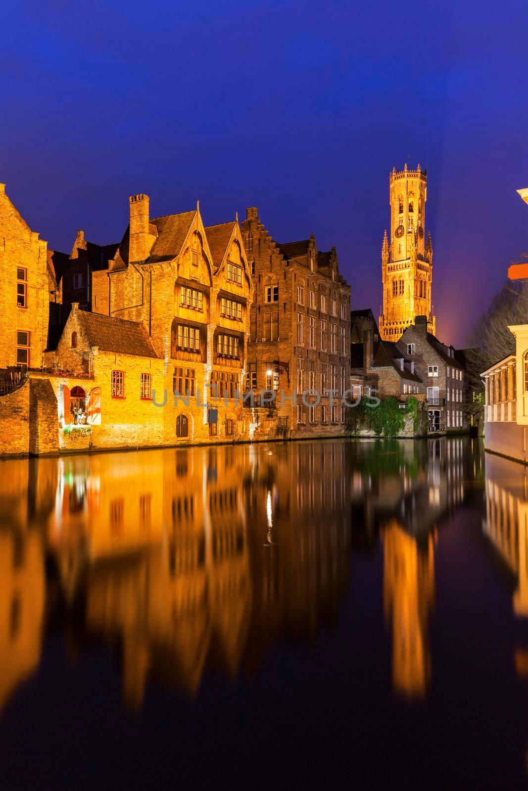 Belfry of Bruges reflected in the canal by benkrut