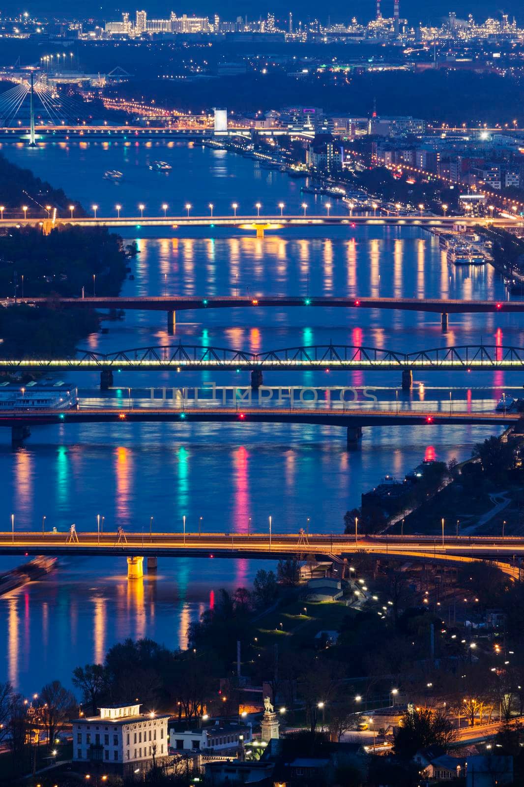 Bridges on Danube River seen at night. Vienna, Austria.