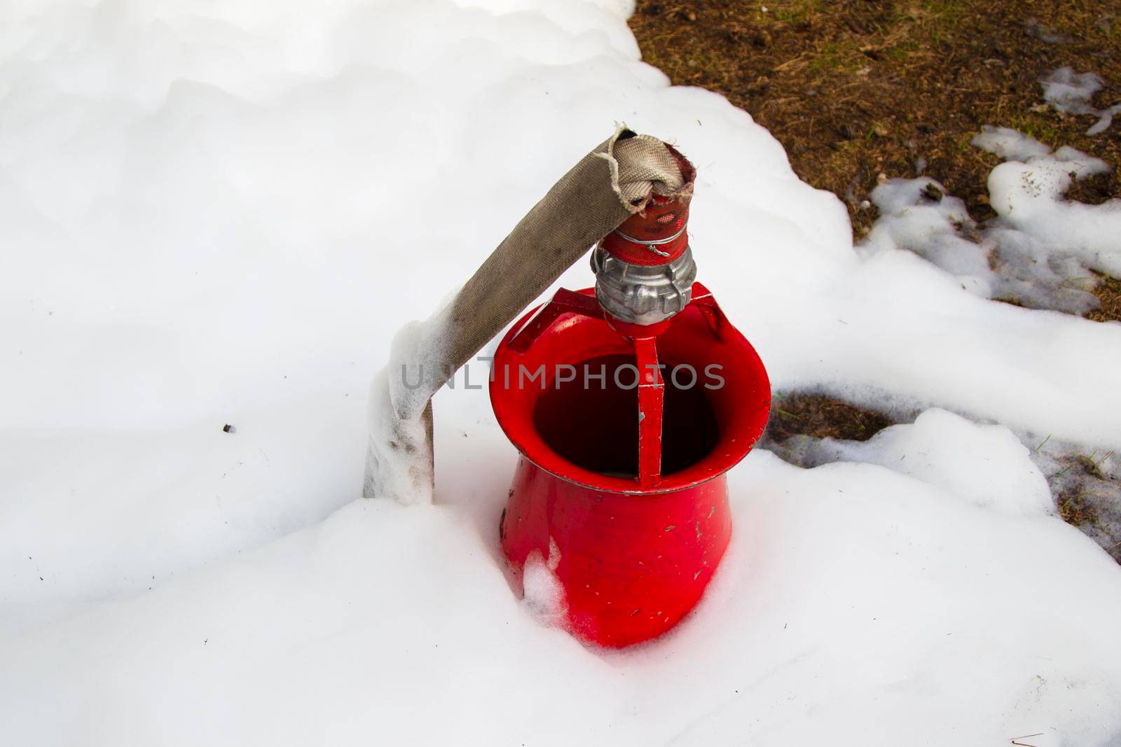 Fire hose with foam. Foam machine to extinguish a fire.