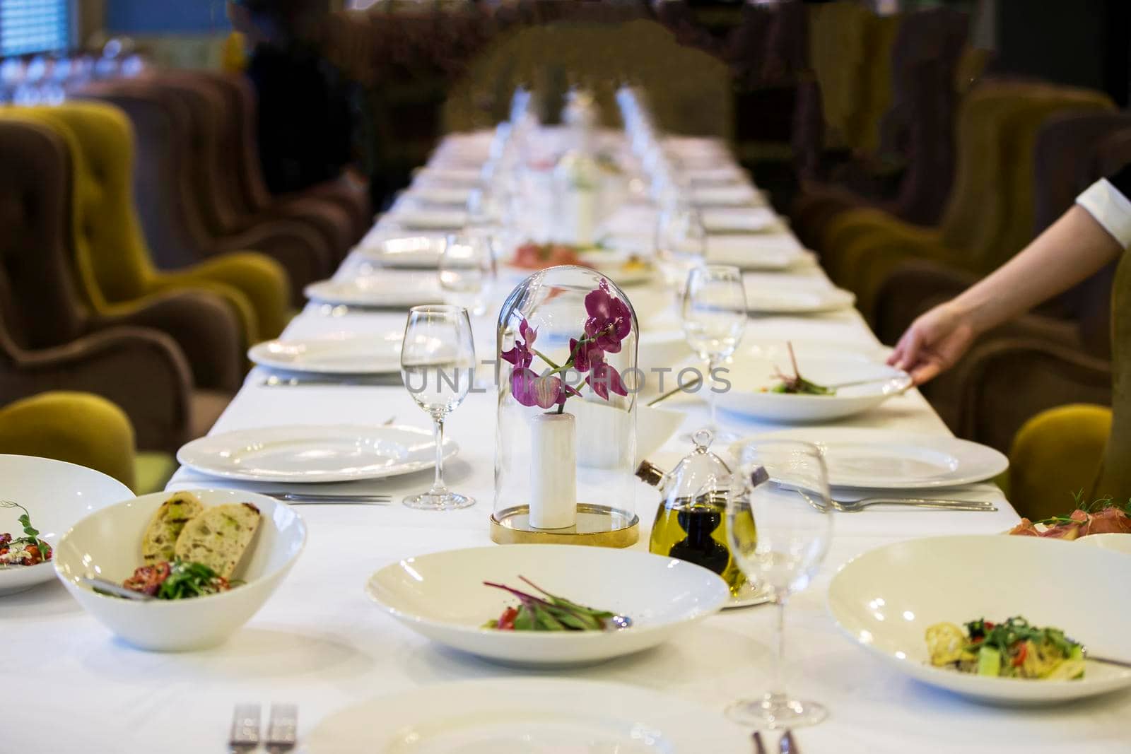 Served table in the restaurant. Lots of empty plates. Preparing for the buffet.