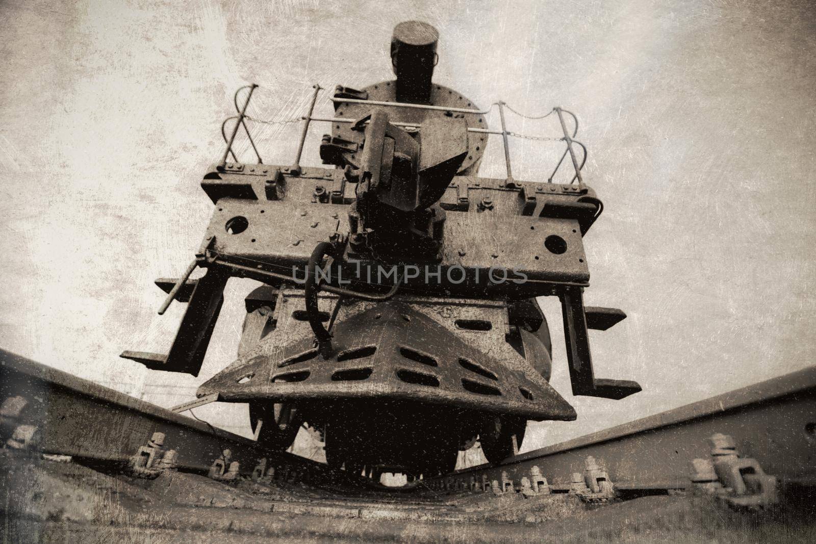 Photo of an old train in black and white with scuffs and scratches