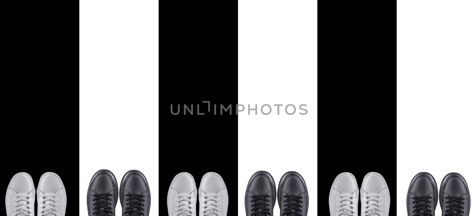 Background sports shoes. Black and white sneakers on a striped background.