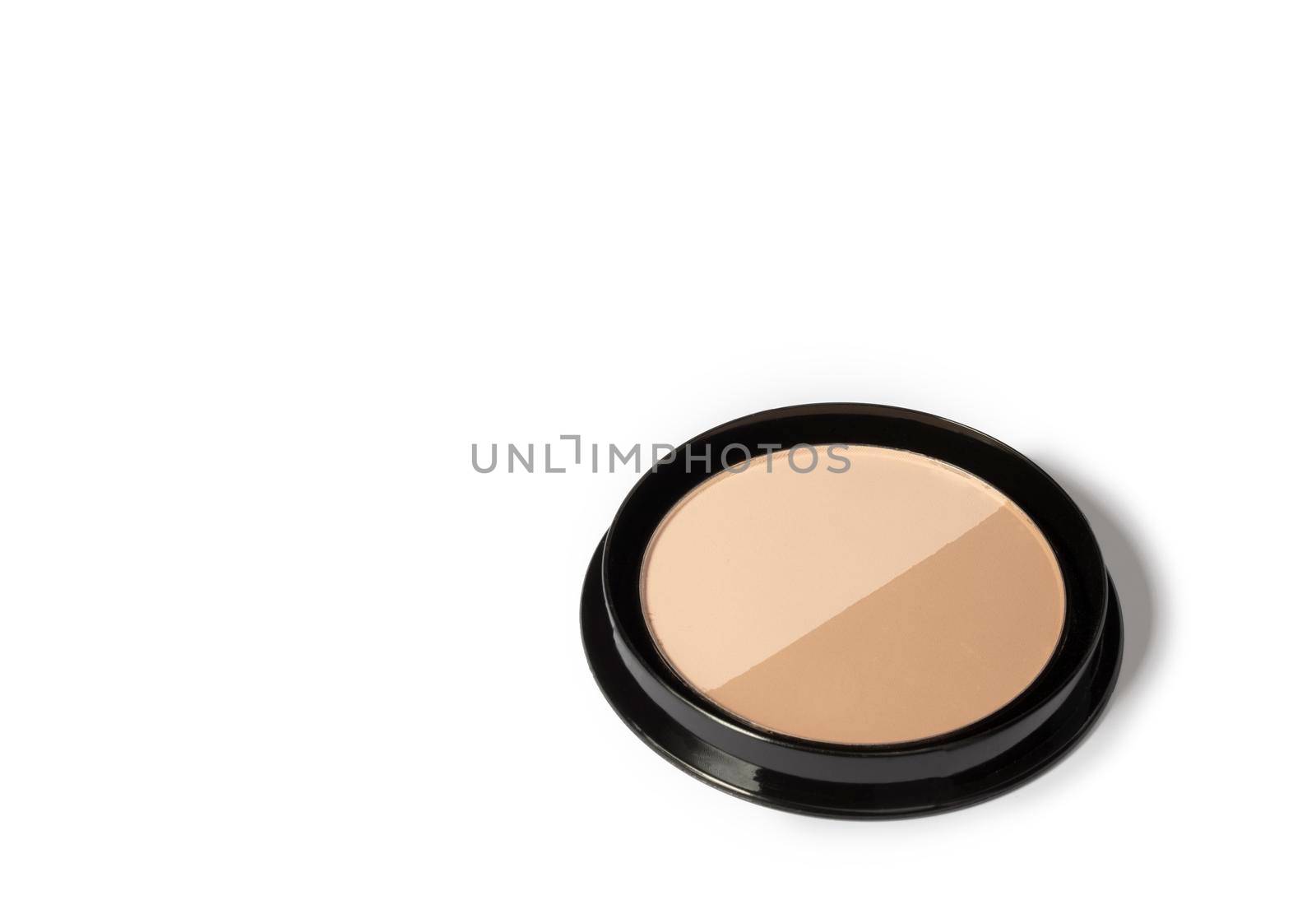Loose powder for face isolated on a white background. Cosmetic basis for the face. Toning cosmetic product.