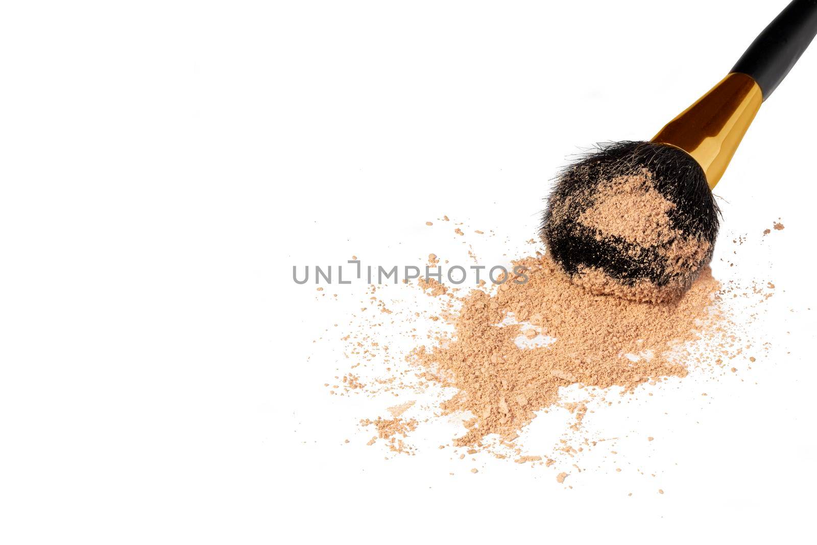 Cosmetic brush with powder isolated on a white background. Loose makeup base.