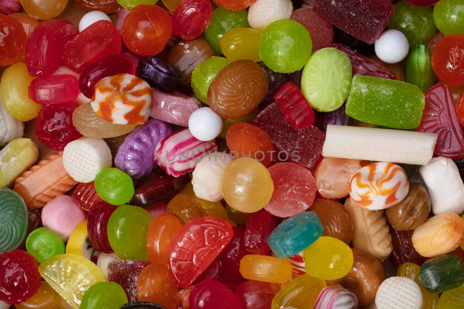 Many sweets. Multi-colored caramel close-up. Background sweets.