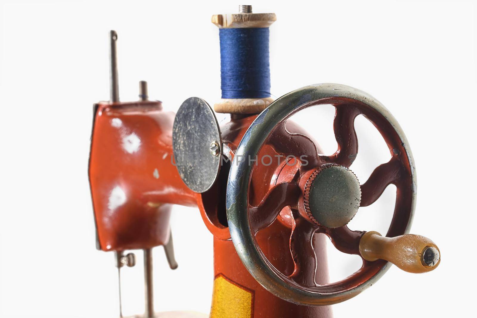 Fragment of a retro sewing machine with bobbin. Children's Soviet sewing machine toy.