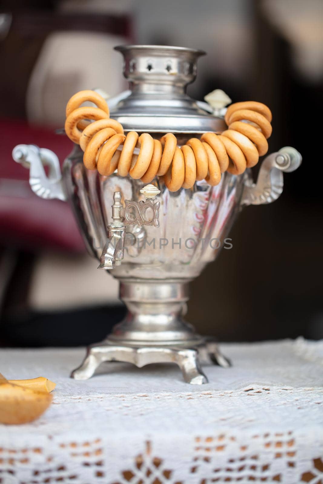 Maslenitsa holiday.Vertically Russian samovar and a lot of bagels. Symbols of Russia.