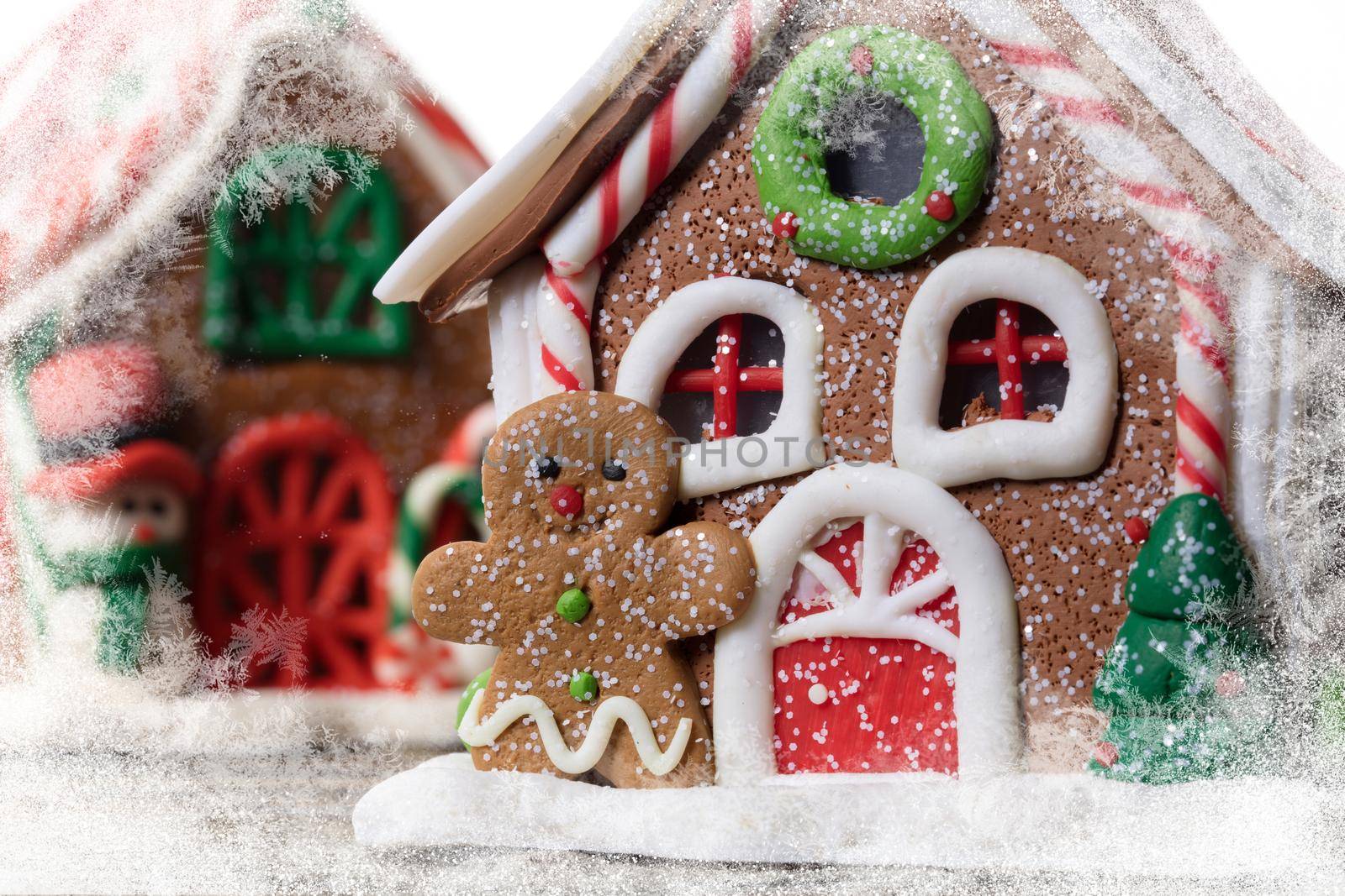 Christmas background. Gingerbread man on the background of a fabulous house.