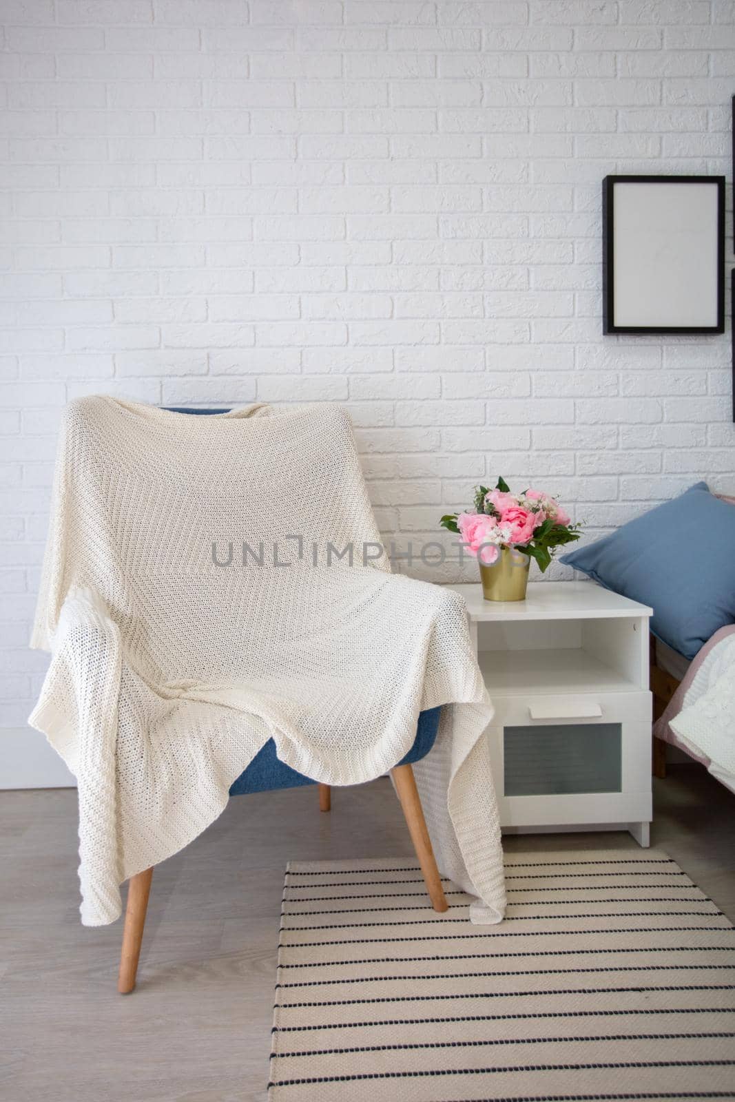 Vertically part of the room with an armchair.