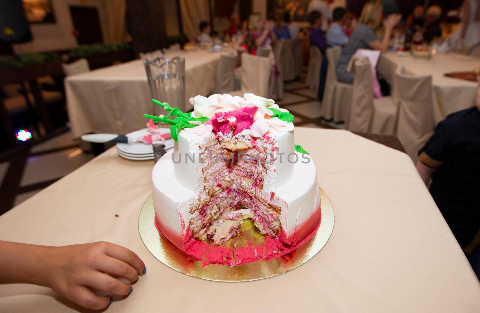 Beautiful cut cake on a restaurant background.