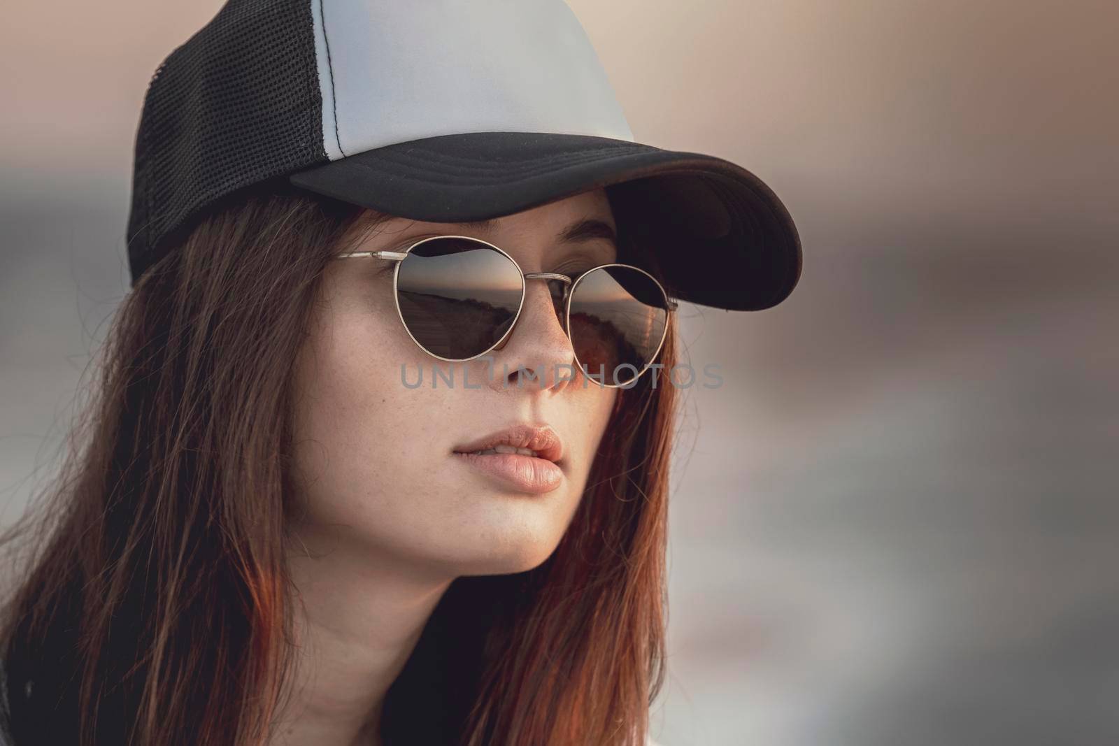 Outdoor portrait of a  beautiful and fashion young woman