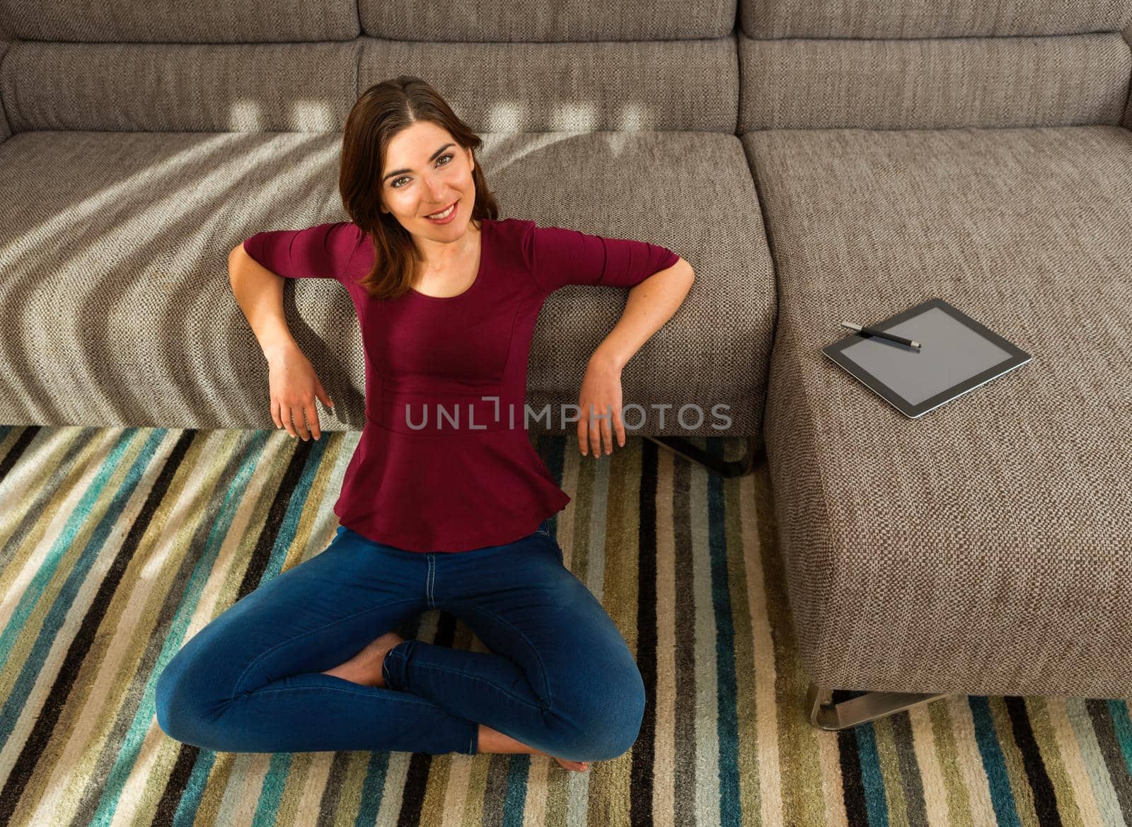 Gorgeous woman at home working with a tablet