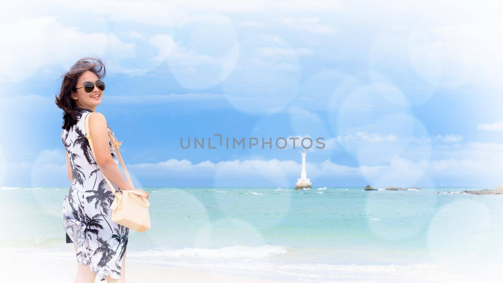 Beautiful woman tourist wearing sunglasse on the beach and sea in summer sky at Tarutao island, Satun, Thailand, add soft effect and texture bokeh for background, 16:9 widscreen