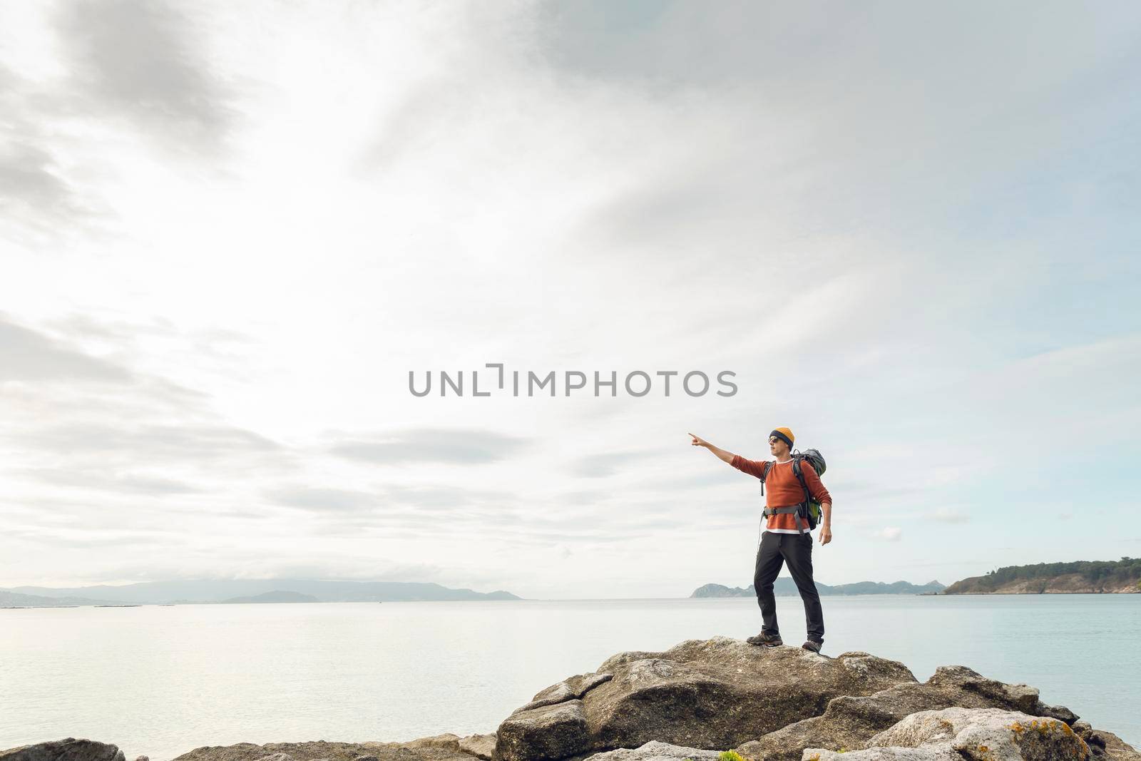 Man pointing to the view by Iko