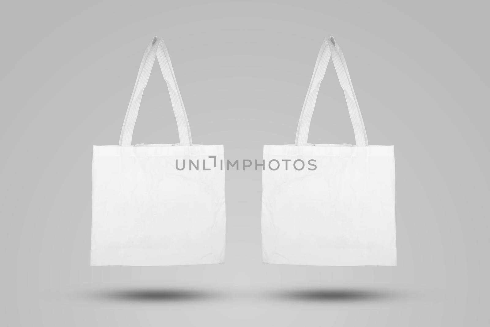 Mockup white tote bag fabric for shopping, mock up canvas bag textile with reusable. by nnudoo