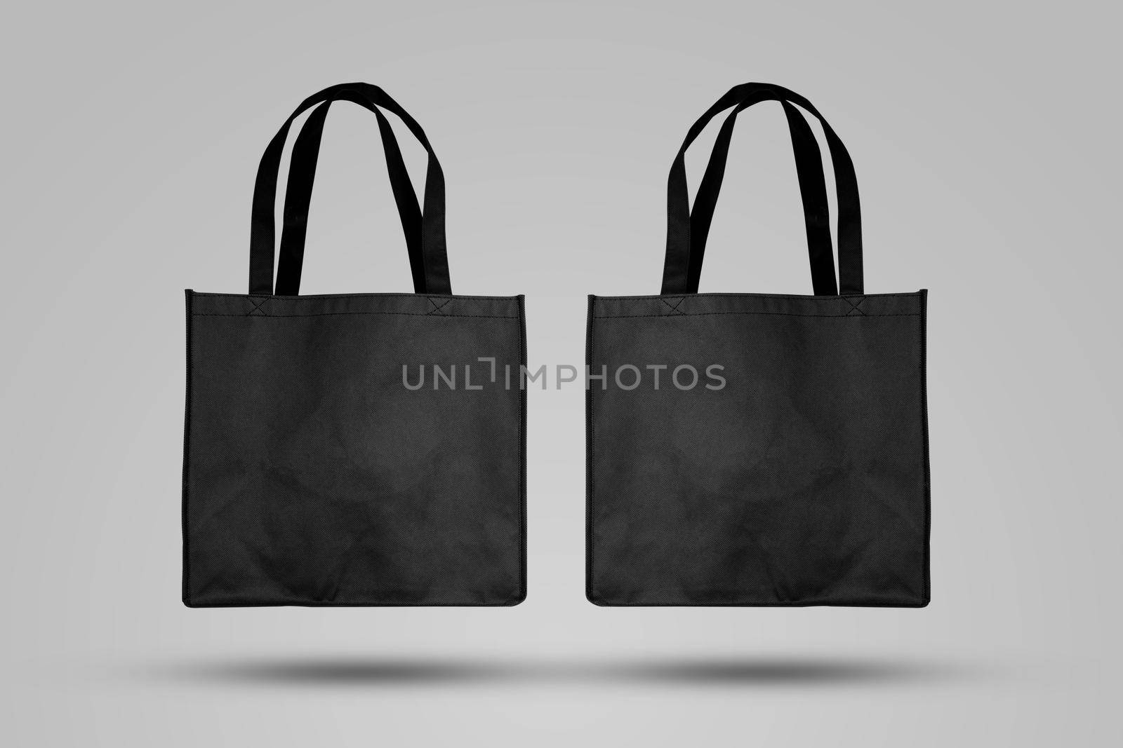 Mockup black tote bag fabric for shopping, mock up canvas bag textile with reusable. by nnudoo