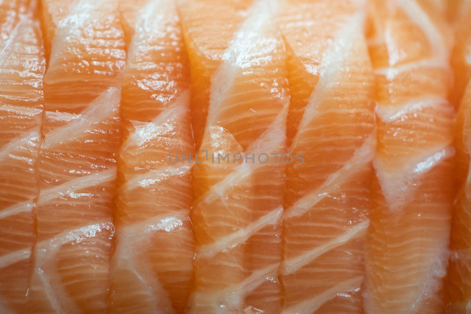 Close up raw fresh Salmon fish meat filleted piece.