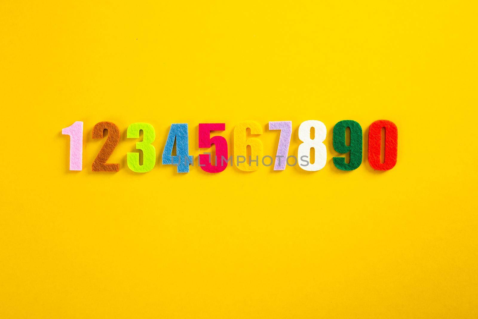 A set of colorful number on yellow background by tehcheesiong
